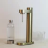 Brus hiilihapotuslaite, Brushed brass